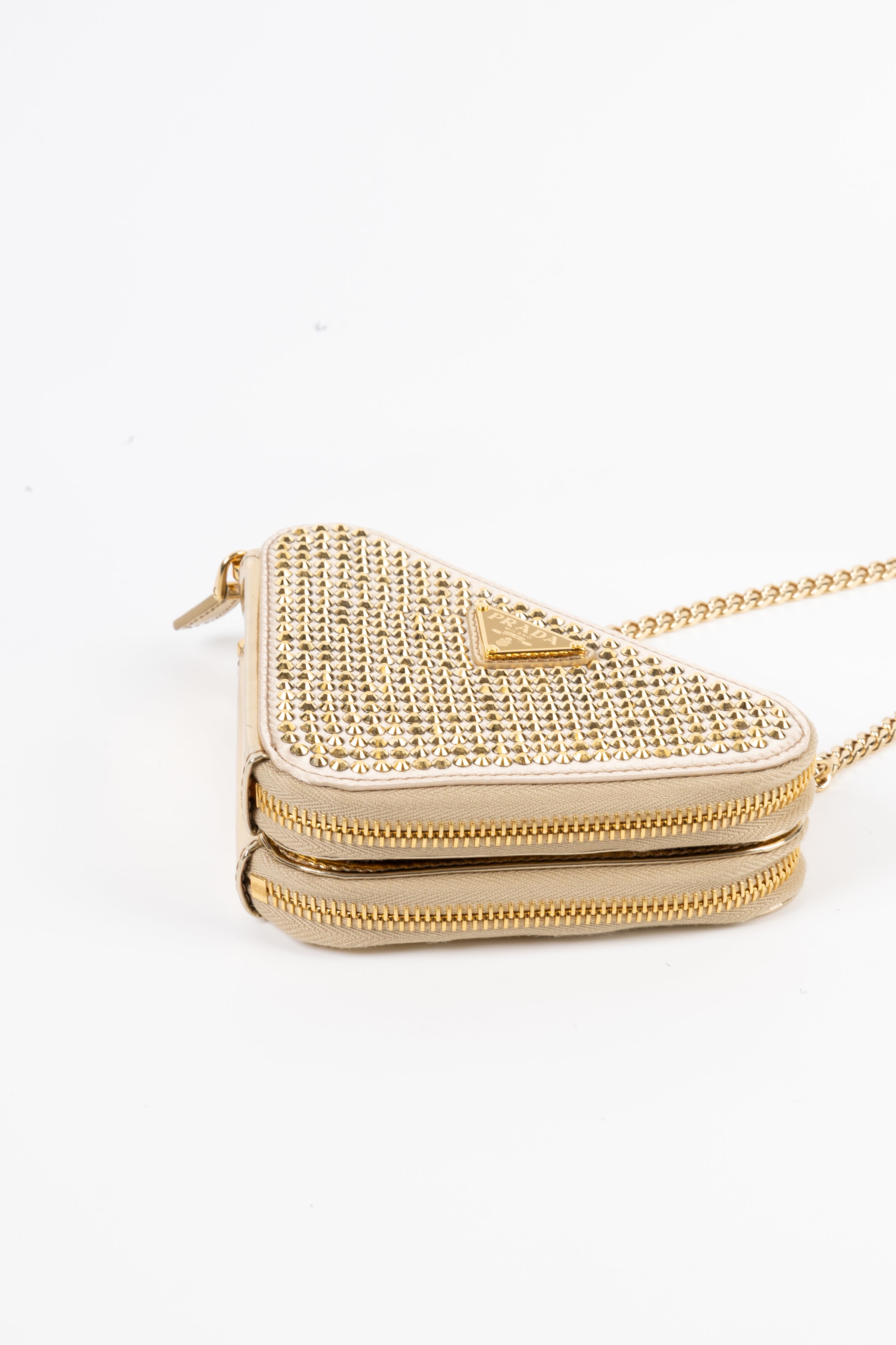 prada triangle gold con cristalli