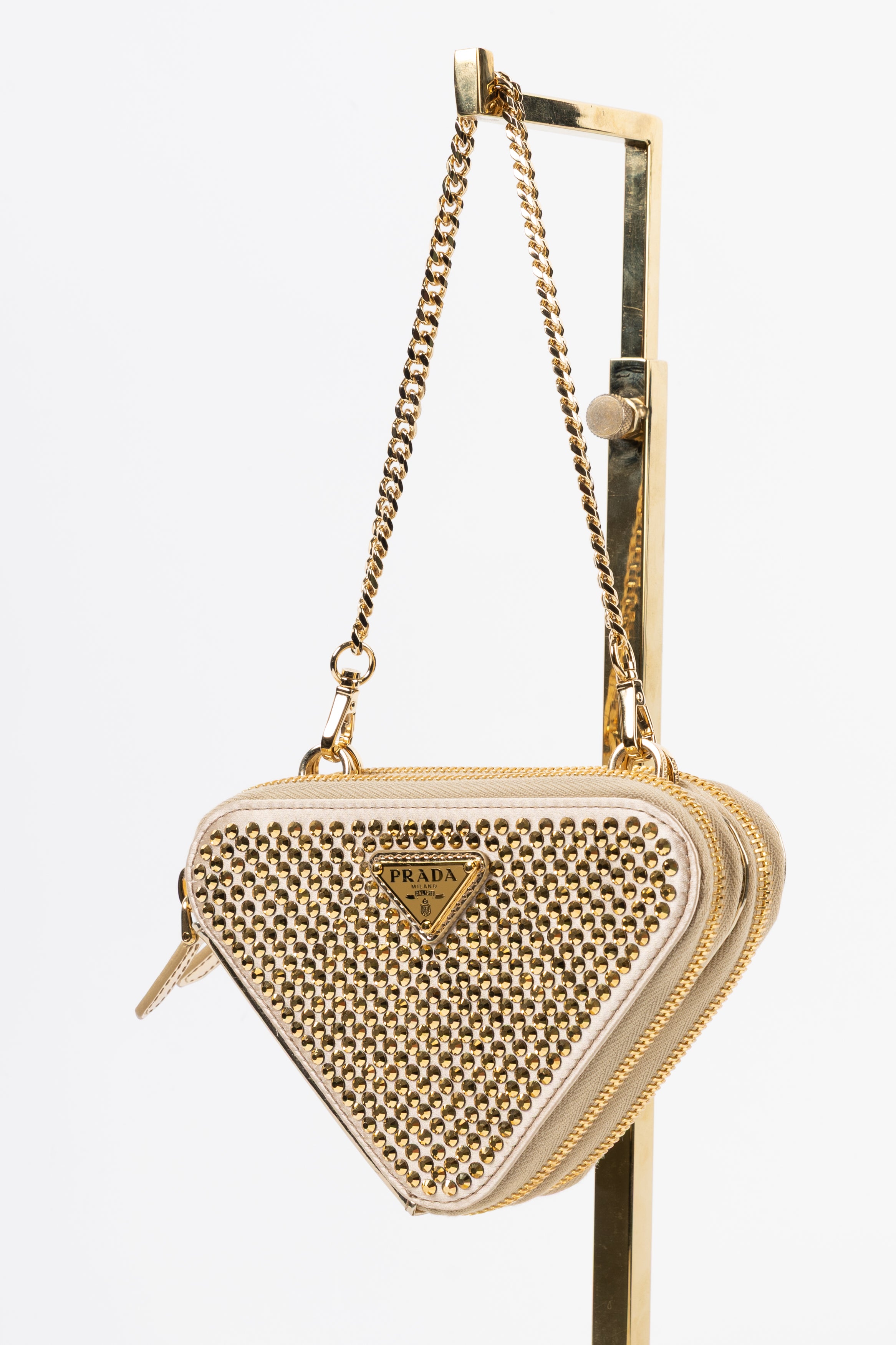 prada triangle gold con cristalli