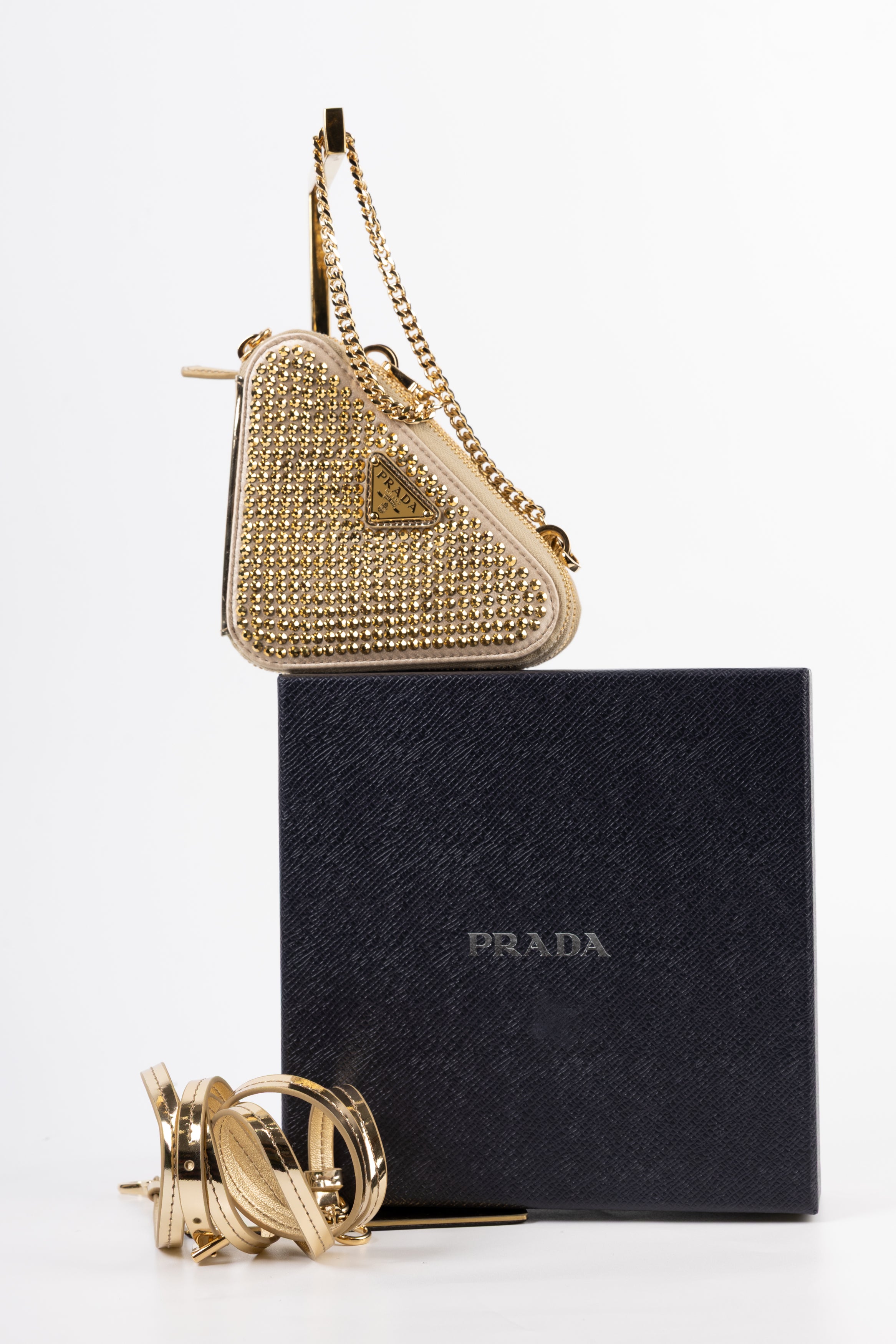 prada triangle gold con cristalli