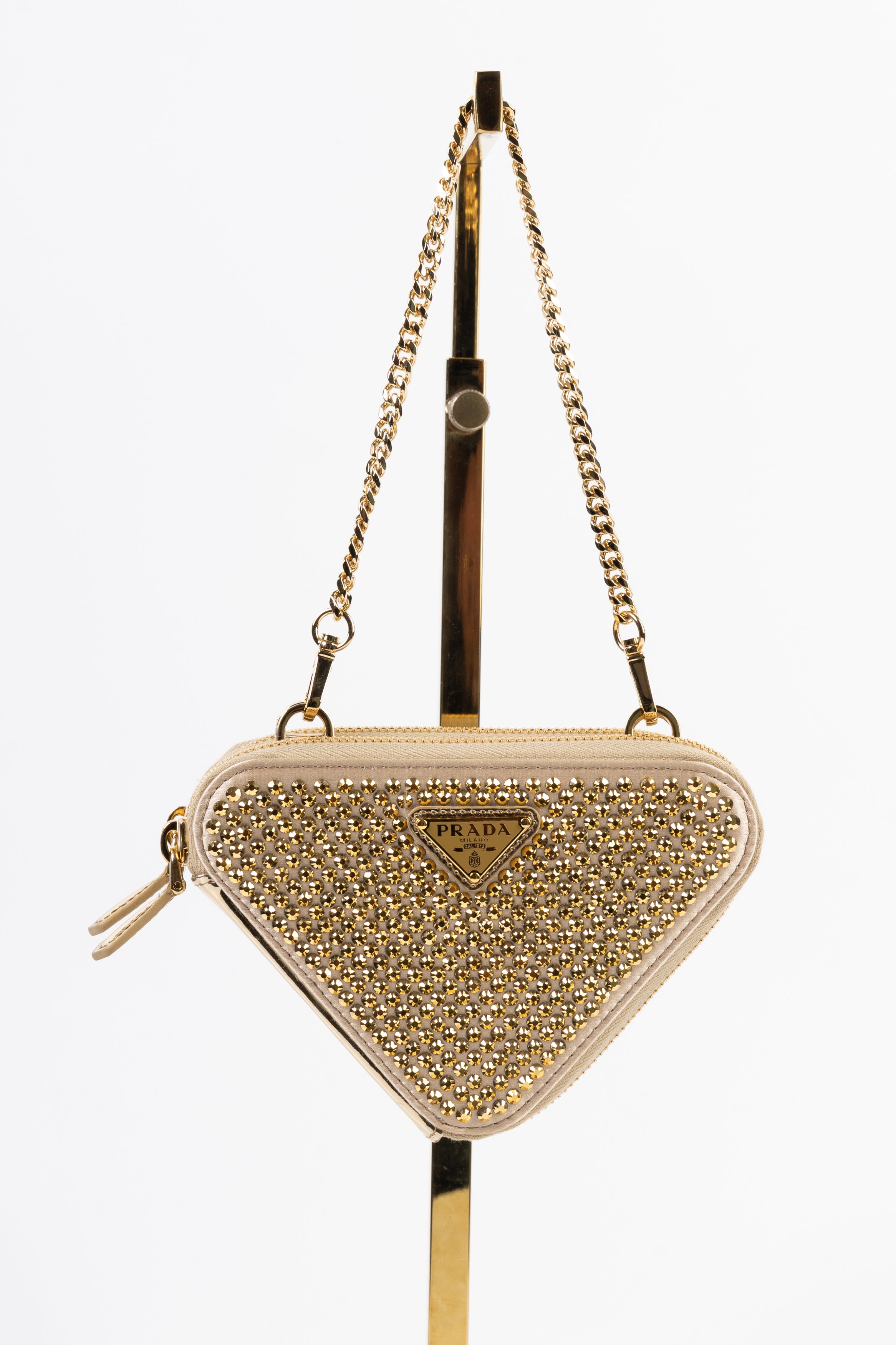 prada triangle gold con cristalli